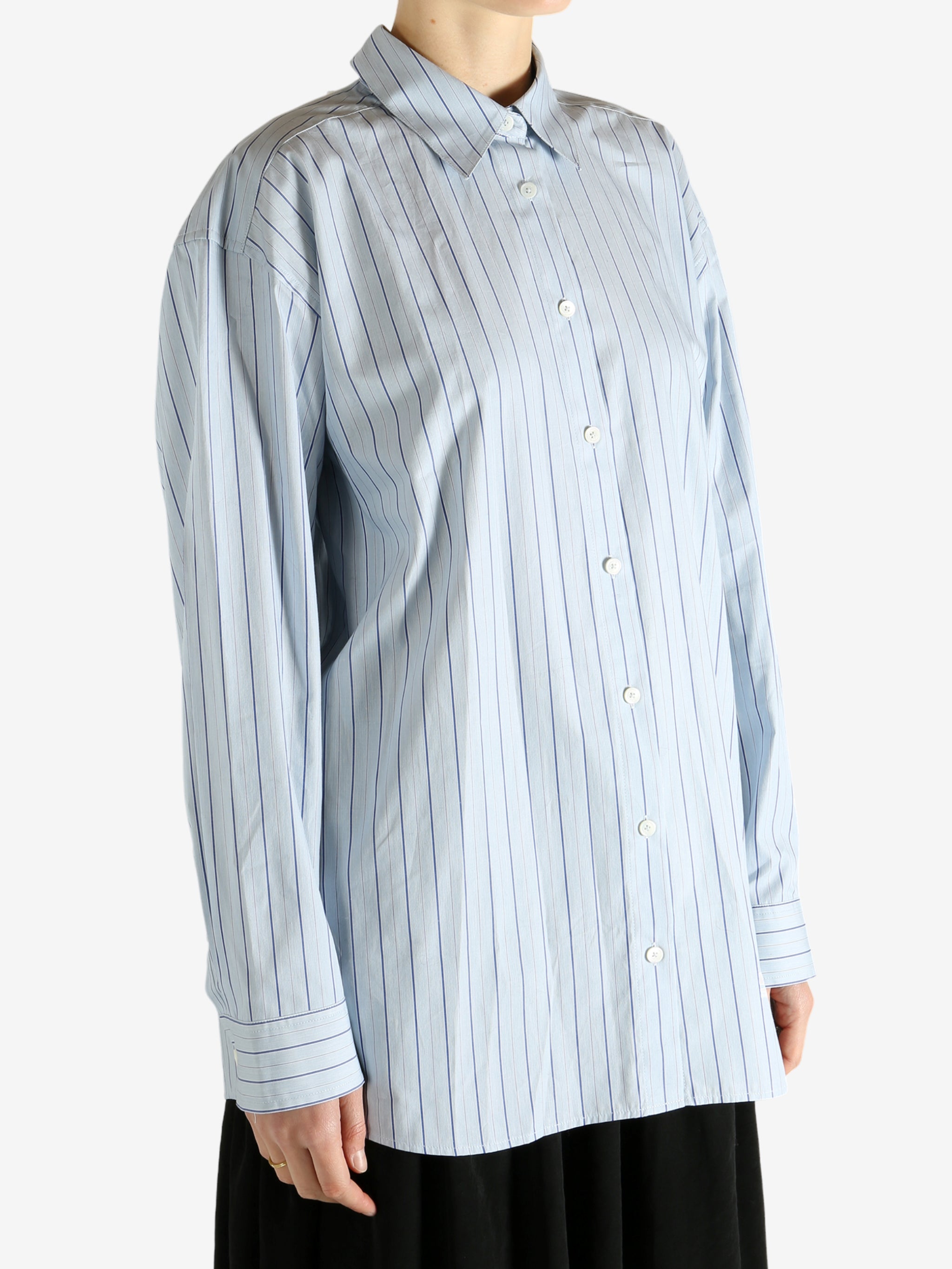 Blue shirts worn by a person, showing the shirts fit