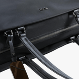 Close up of black bag, showing texture of the nylon fabric
