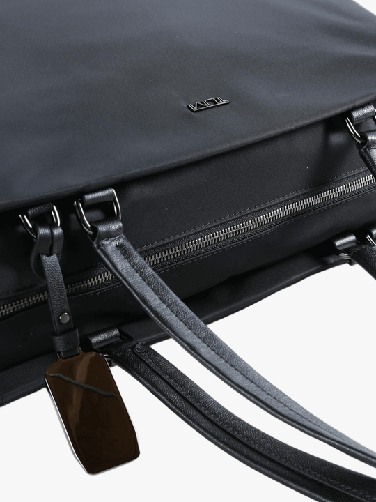 Close up of black bag, showing texture of the nylon fabric