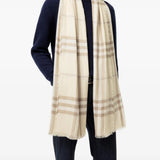Tan scarf worn by a person, showing the scarf fit