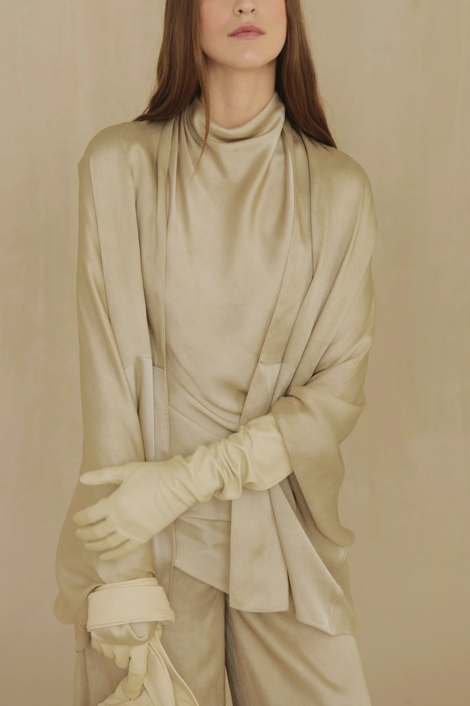 Tan top worn by a person, showing the top fit