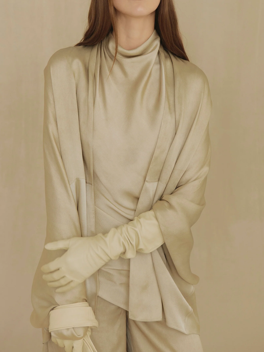 Tan top worn by a person, showing the top fit