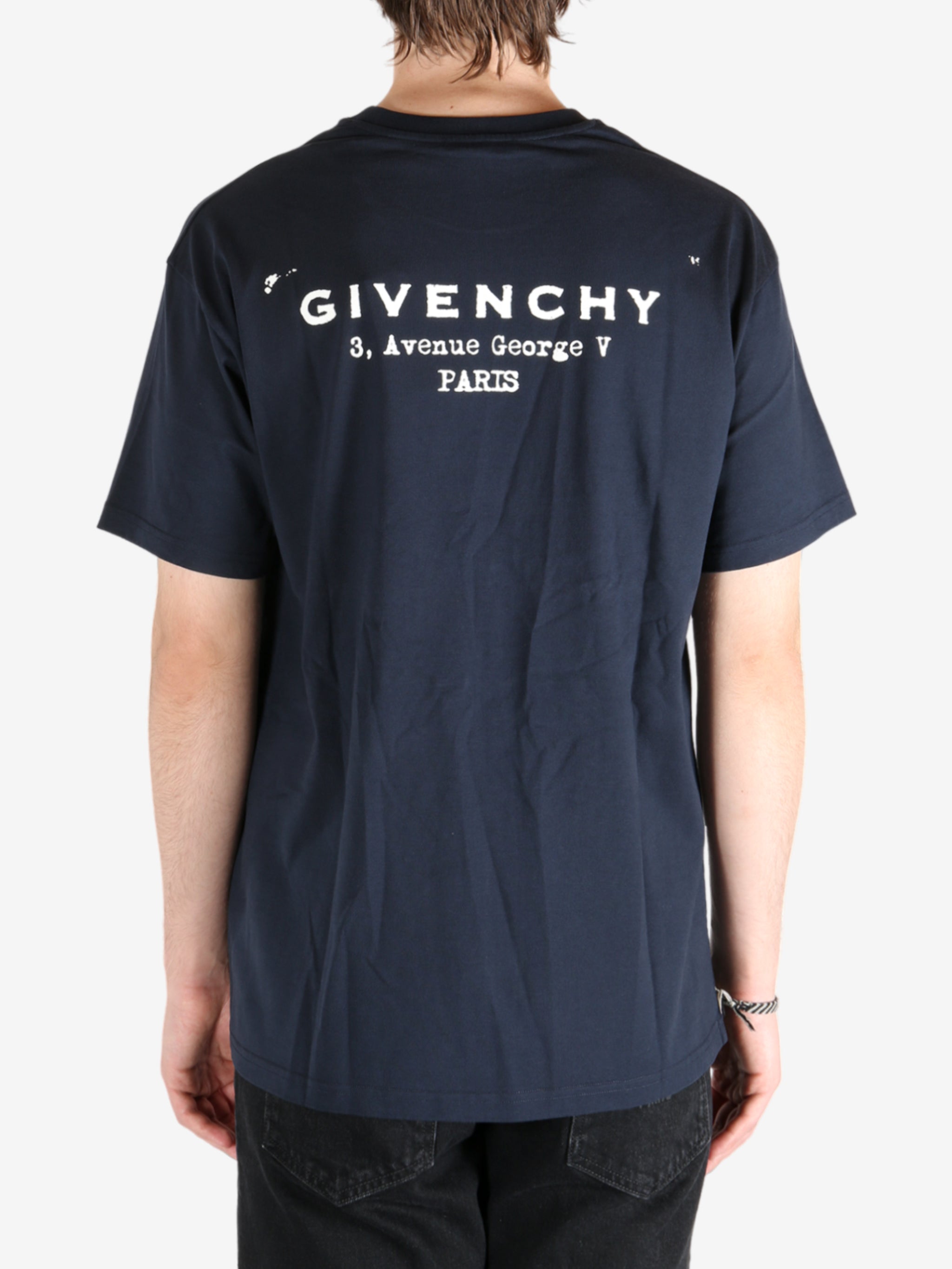 Navy t-shirt worn by a person, showing the t-shirt's fit