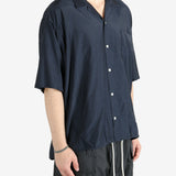 Blue shirt worn by a person, showing the shirt's fit