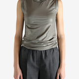 Grey tops worn by a person, showing the tops fit