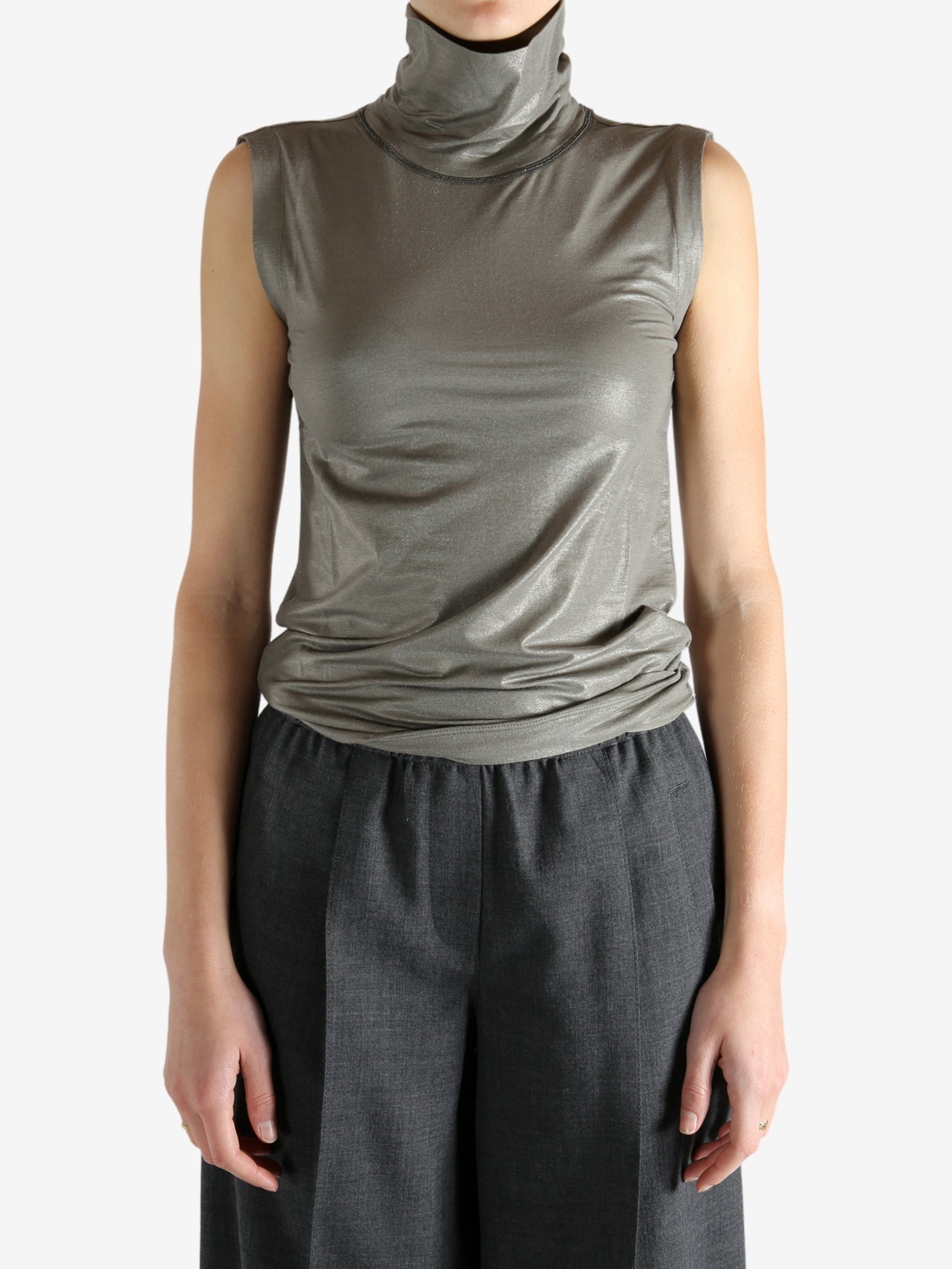 Grey tops worn by a person, showing the tops fit