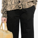 Close up of the black pant, showing texture of the cotton fabric