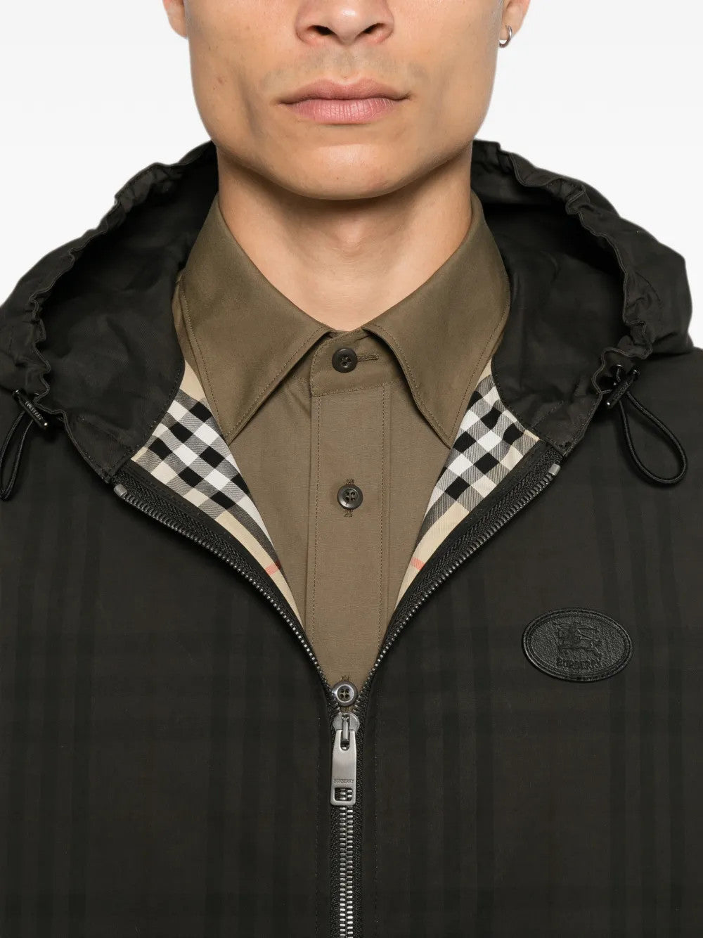 Black jacket worn by a person, showing the jacket fit