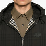 Black jacket worn by a person, showing the jacket fit