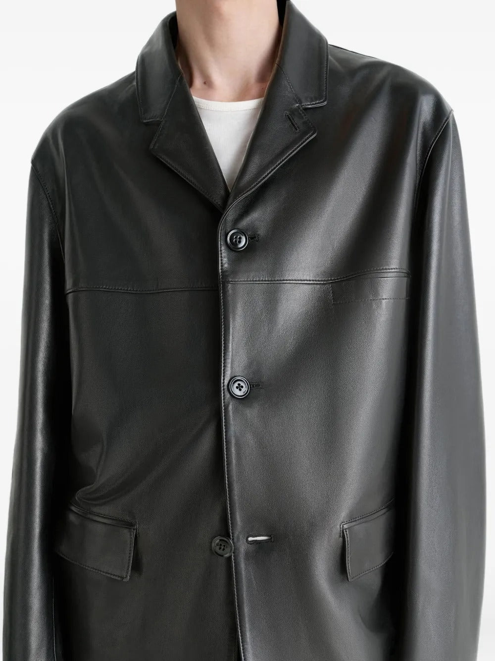 Close up of the black jacket, showing texture of the leather fabric