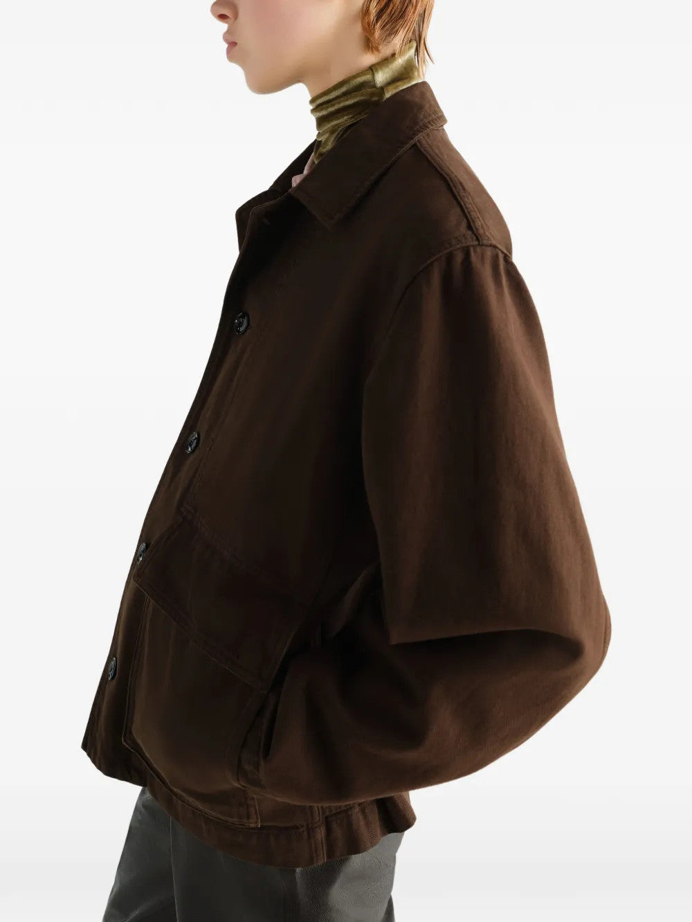 Brown jacket worn by a person, showing the jacket fit