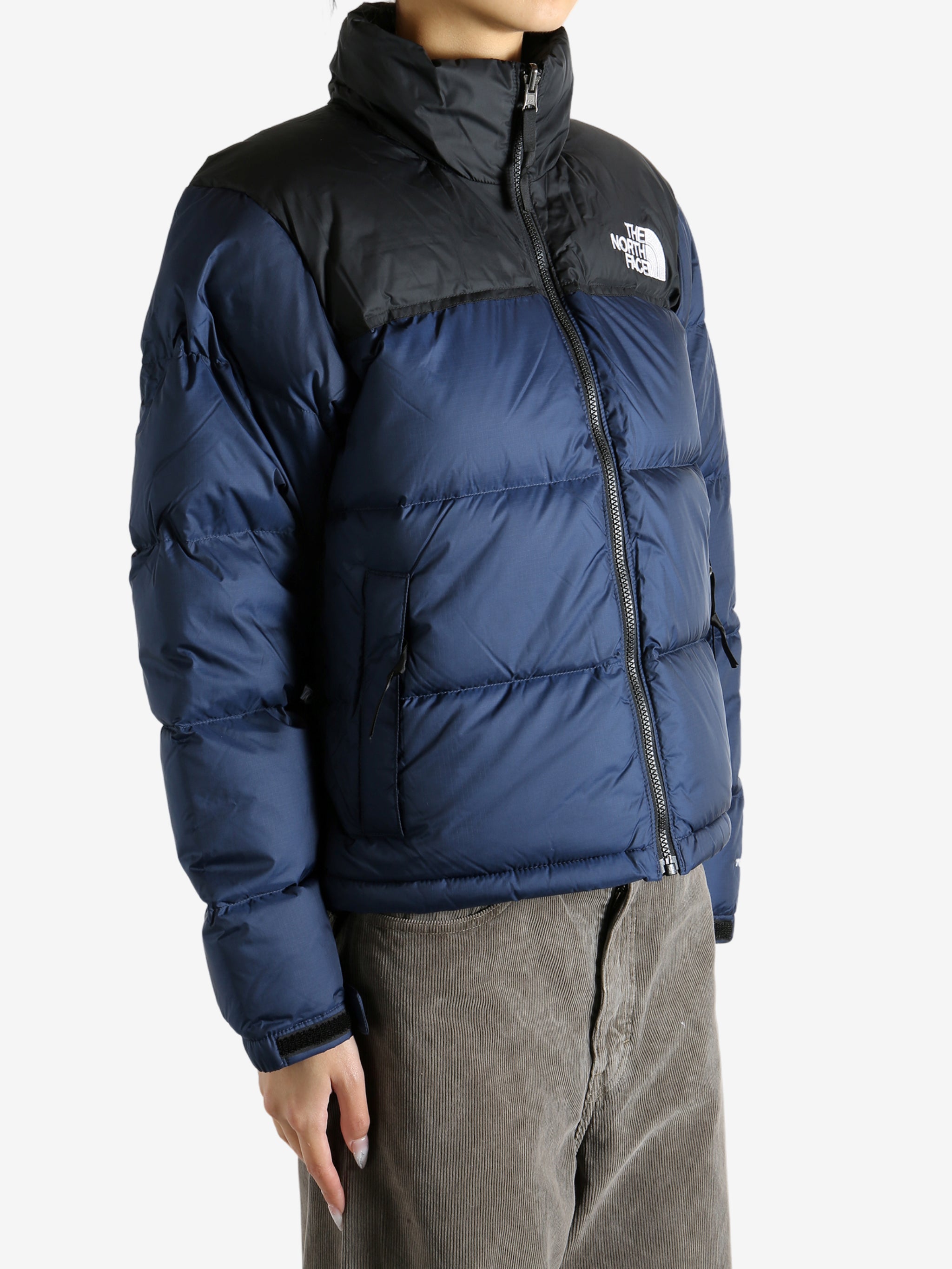 Navy jacket worn by a person, showing the jacket fit