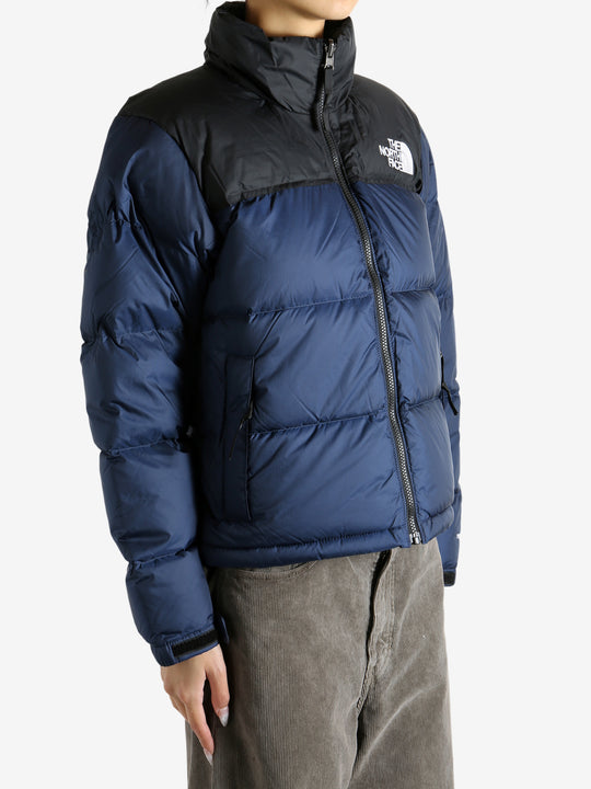 Navy jacket worn by a person, showing the jacket fit