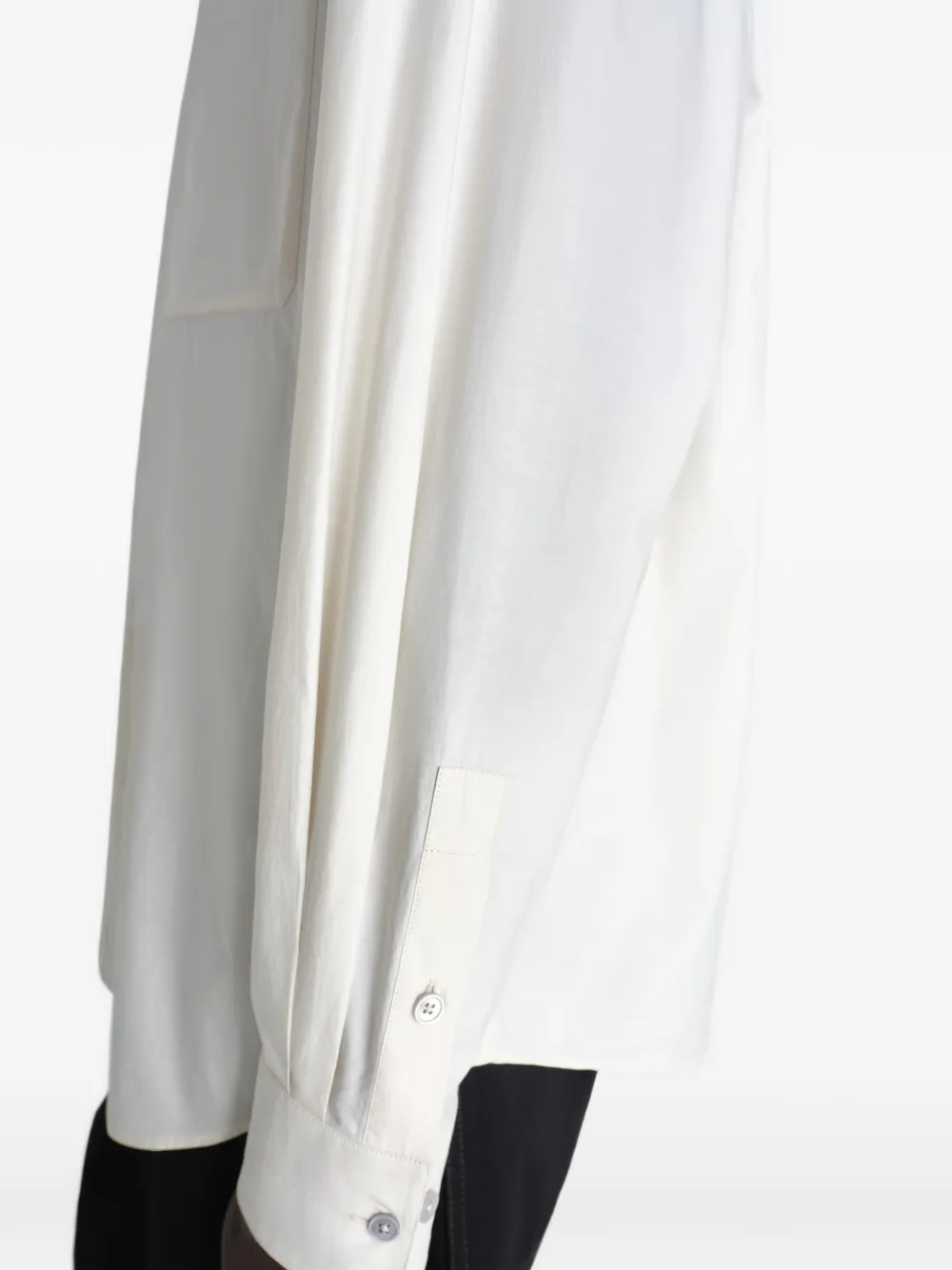Close up of white shirts, showing texture of the cotton and silk fabric