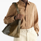 Brown bag worn by a person, showing the bag fit