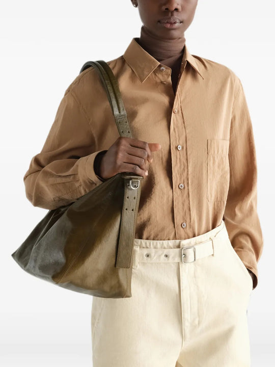 Brown bag worn by a person, showing the bag fit