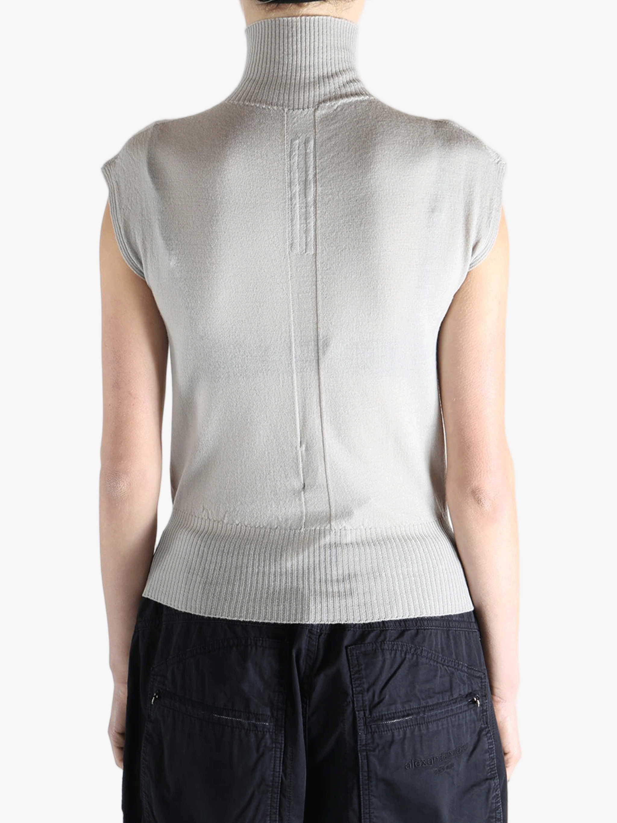 White top worn by a person, showing the top's fit