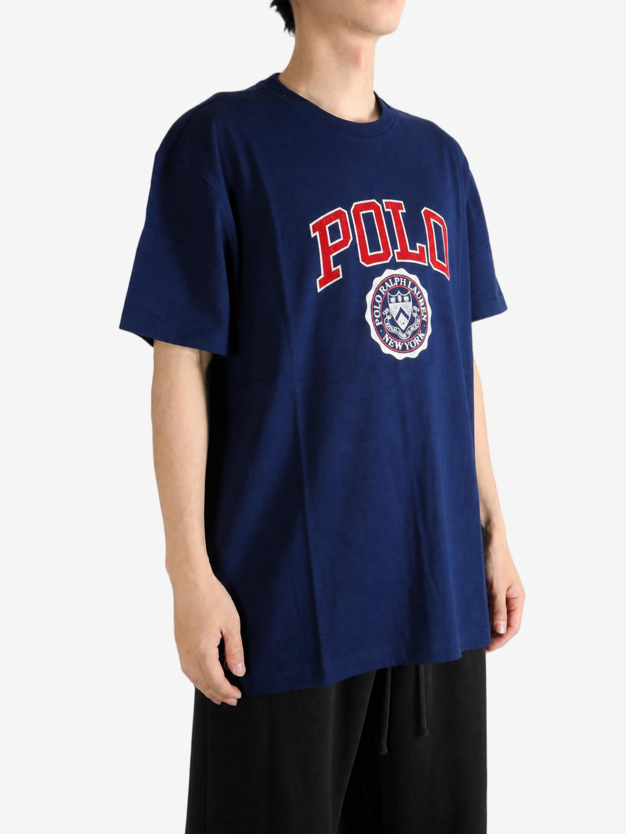 Navy t-shirt worn by a person, showing the t-shirt fit