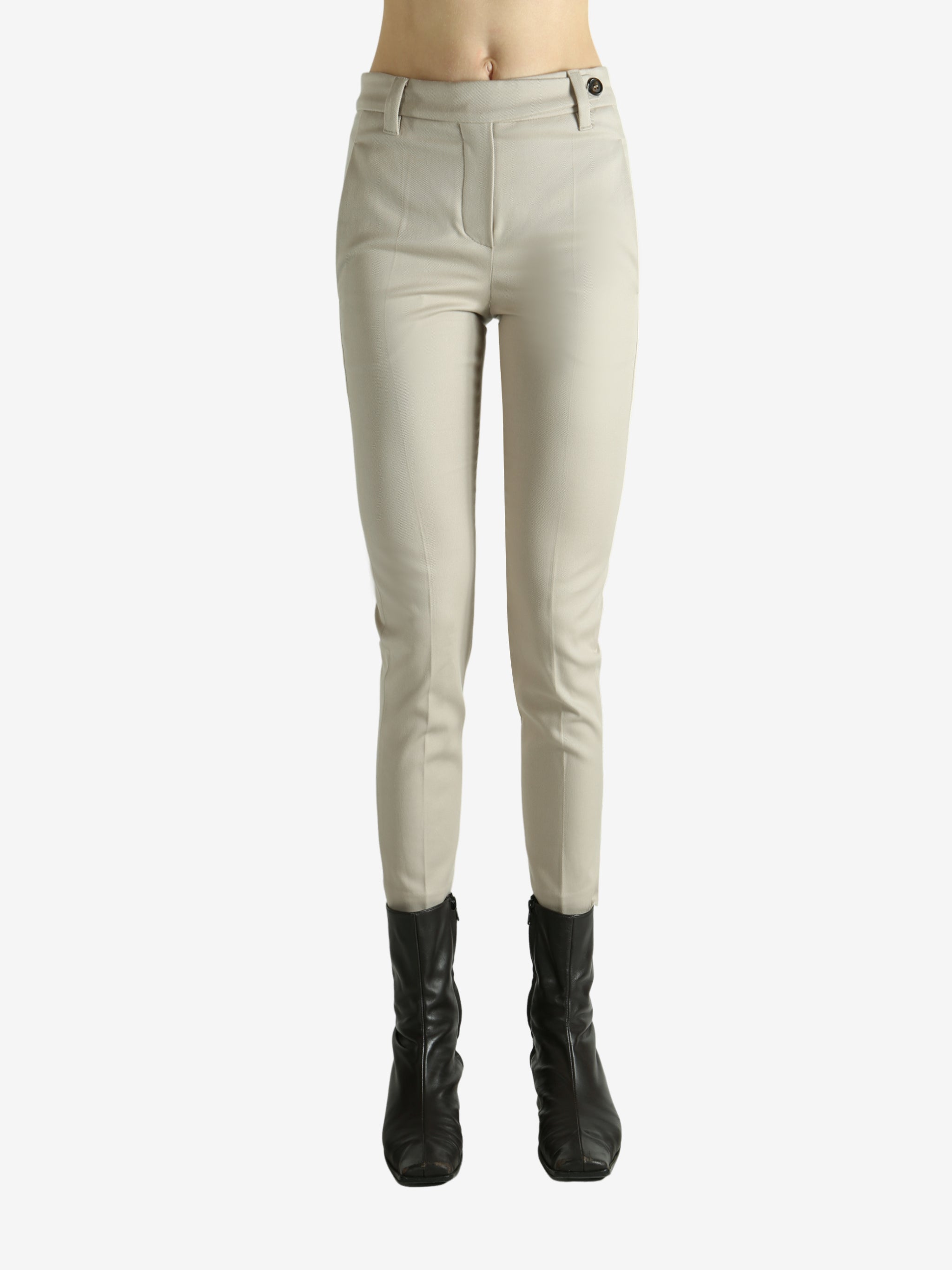 Tan pants worn by a person, showing the pants fit