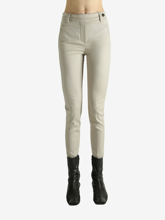 Tan pants worn by a person, showing the pants fit