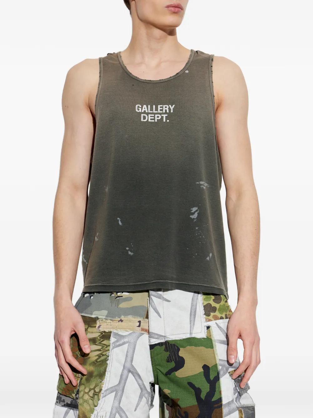 Black top worn by a person, showing the top fit