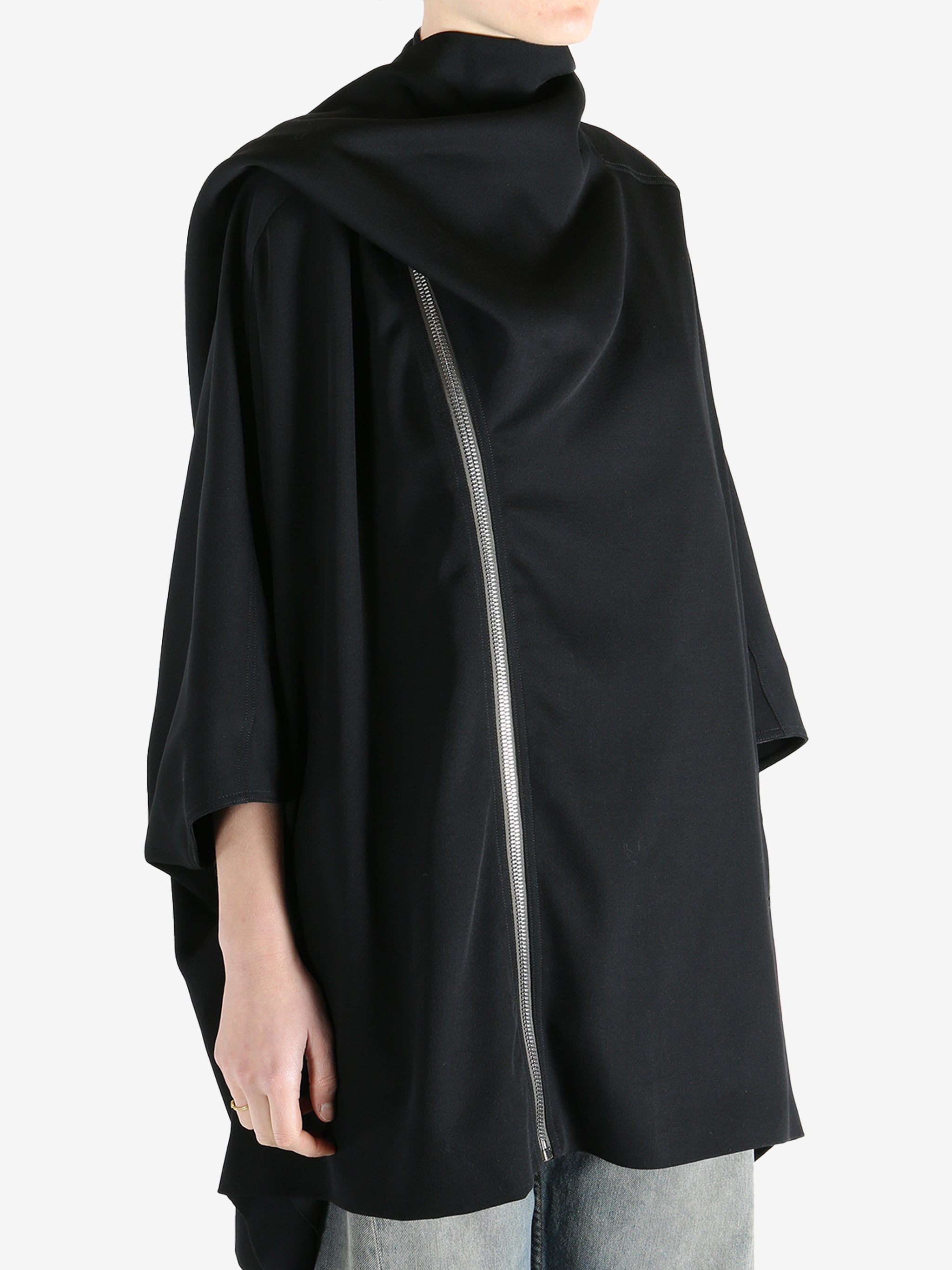 Black jackets worn by a person, showing the jackets fit