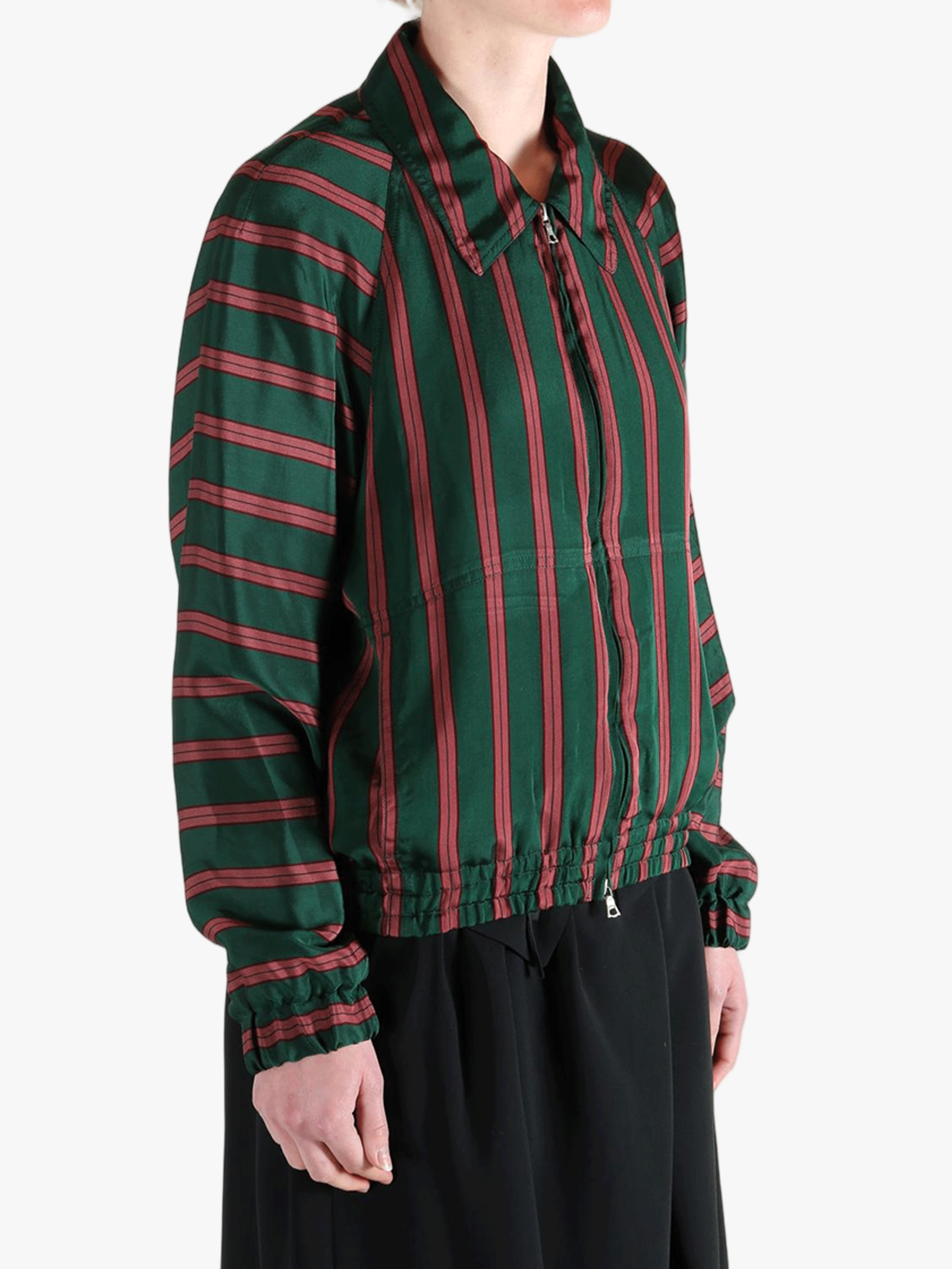 Green jacket worn by a person, showing the jacket fit