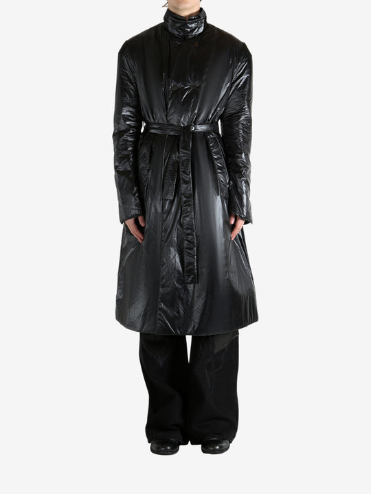 Black coat worn by a person, showing the coat's fit