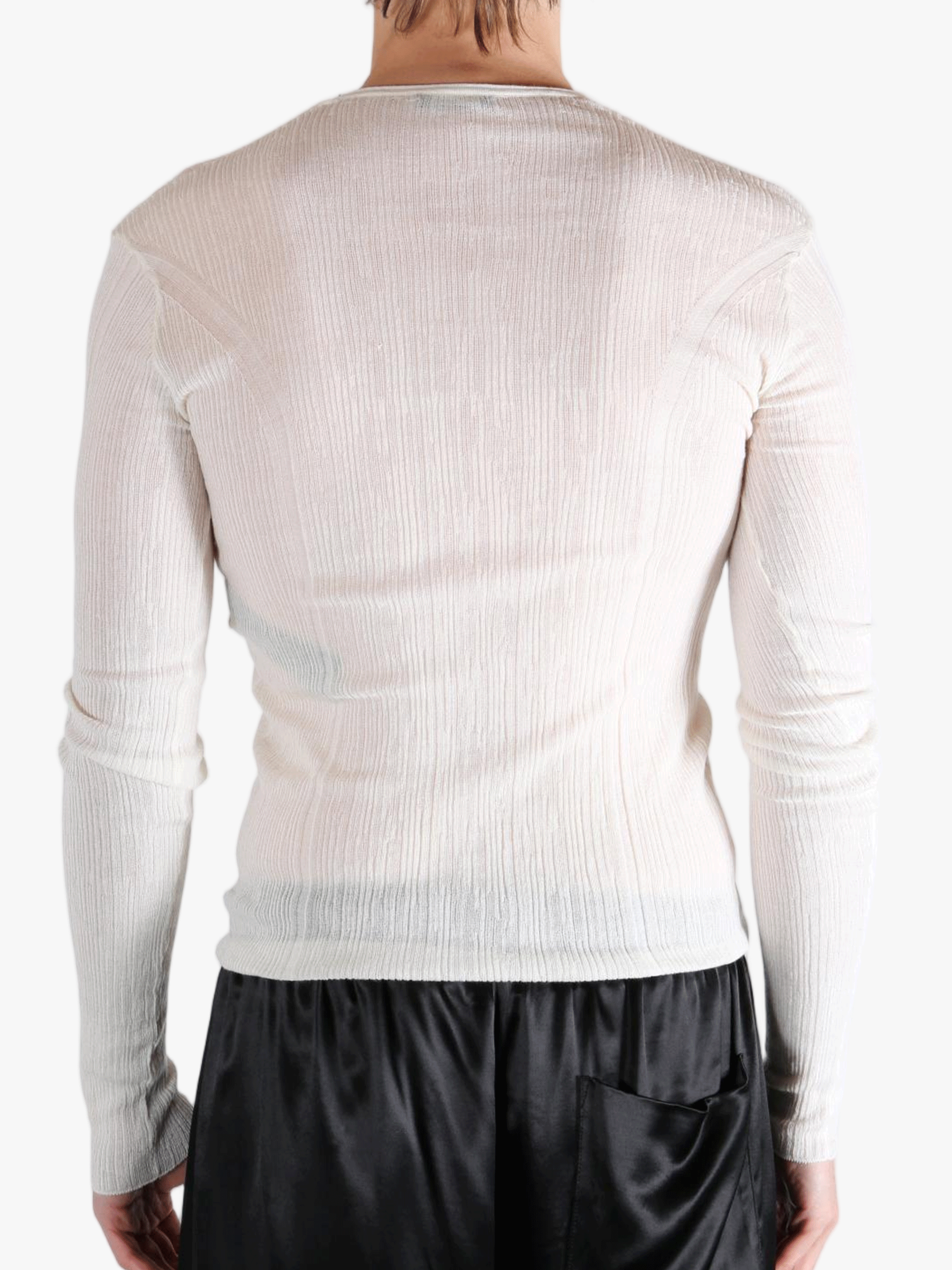 White top worn by a person, showing the top fit