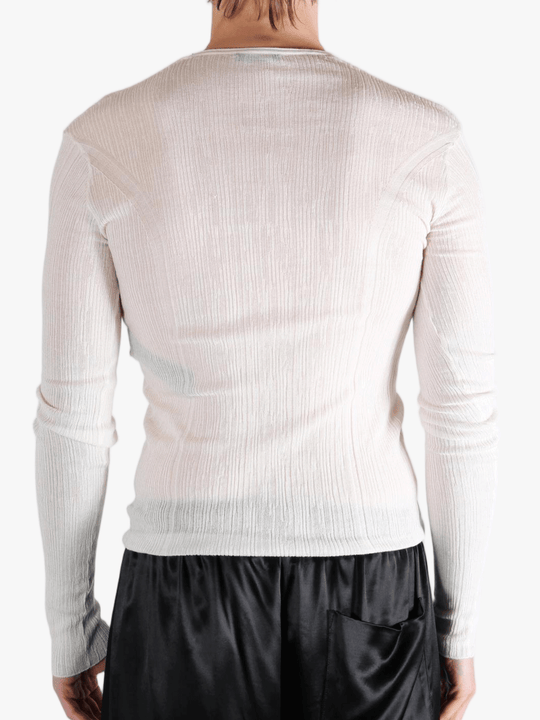 White top worn by a person, showing the top fit
