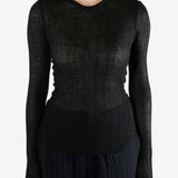 Black topworn by a person, showing the top fit