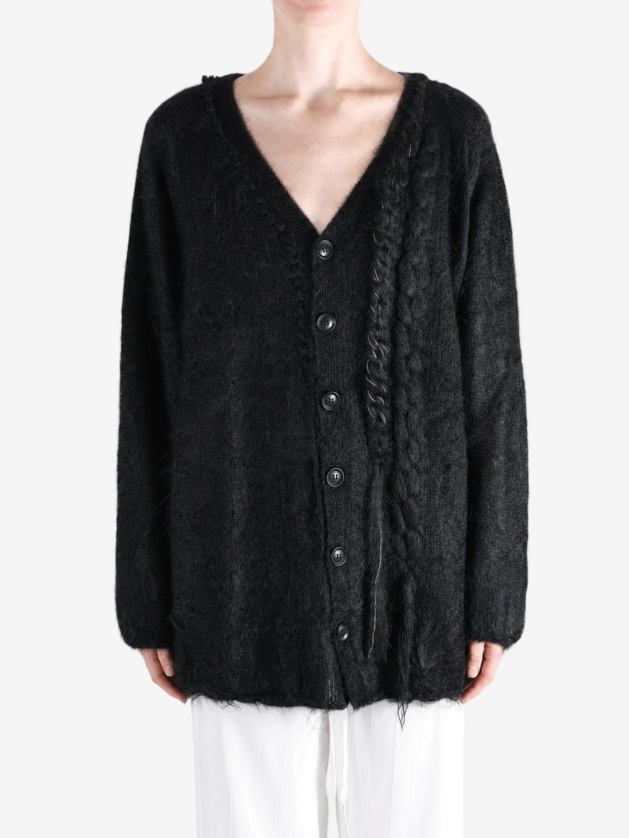 Black jacket worn by a person, showing the jacket fit