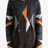 Brown top worn by a person, showing the top's fit