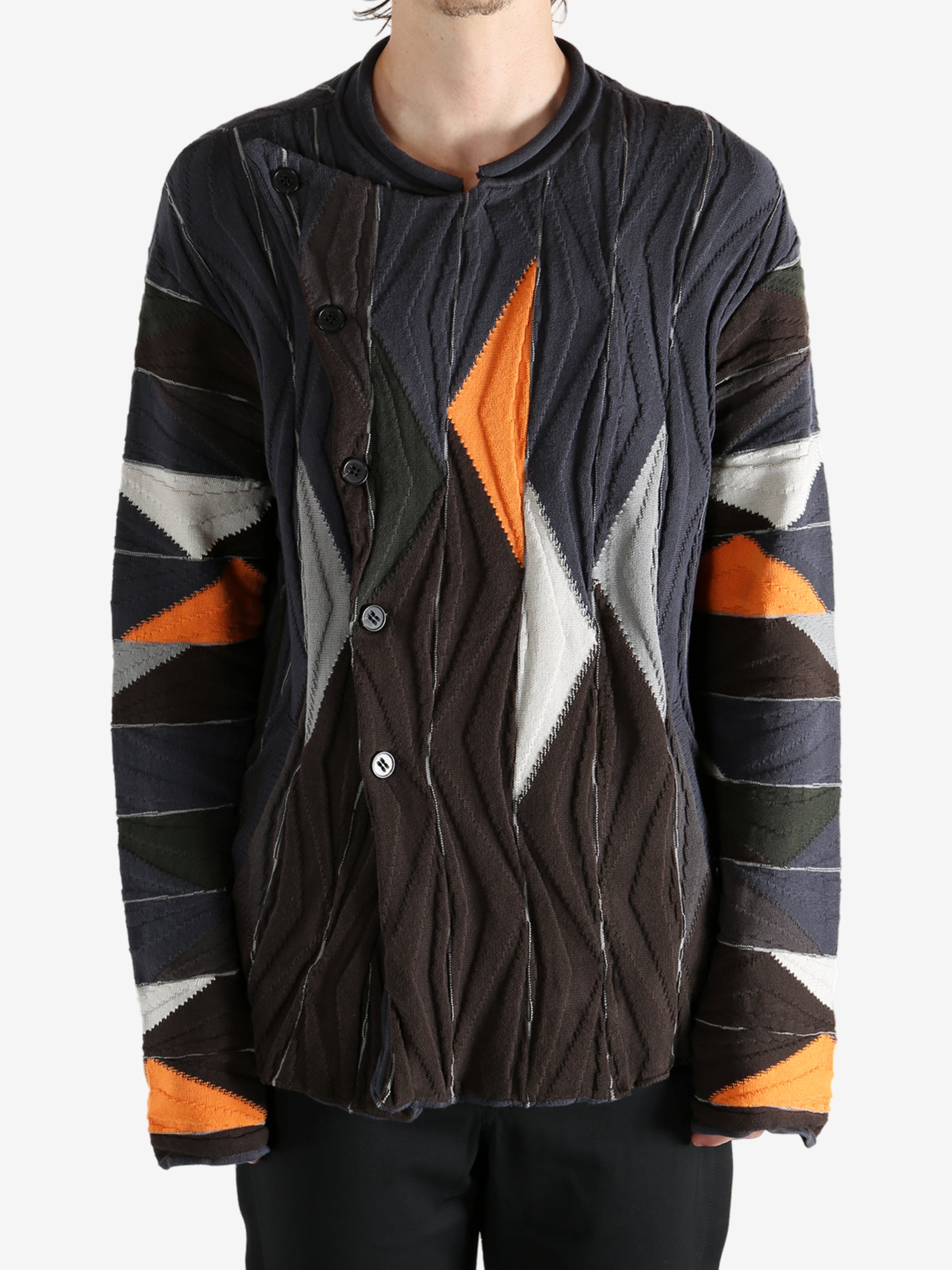 Brown top worn by a person, showing the top's fit