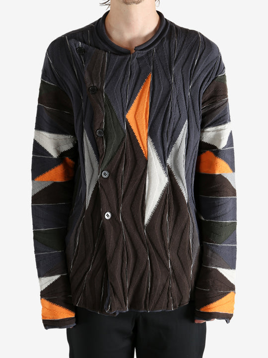 Brown top worn by a person, showing the top's fit