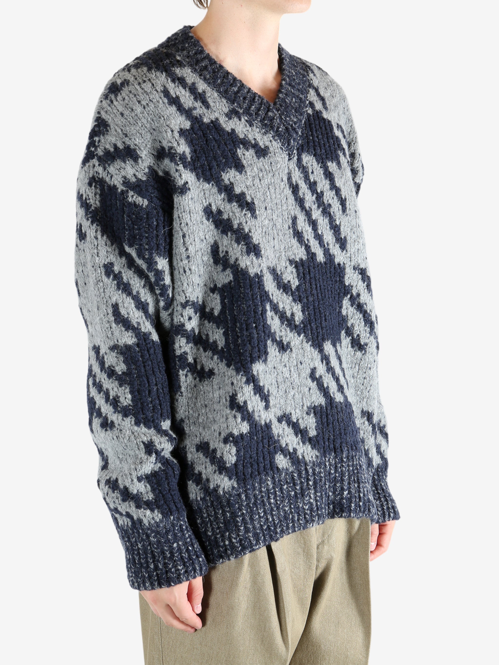 Blue sweater worn by a person, showing the sweater fit