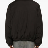 Brown coat worn by a person, showing the coat's fit