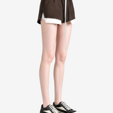 Brown shorts worn by a person, showing the shorts fit