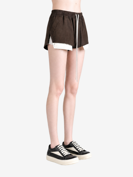 Brown shorts worn by a person, showing the shorts fit