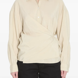 White shirt worn by a person, showing the shirt's fit