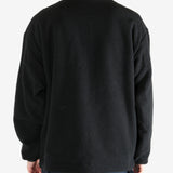 Black jacket worn by a person, showing the jacket's fit