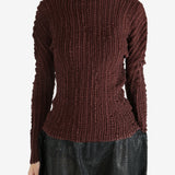 Brown shirt worn by a person, showing the shirt's fit