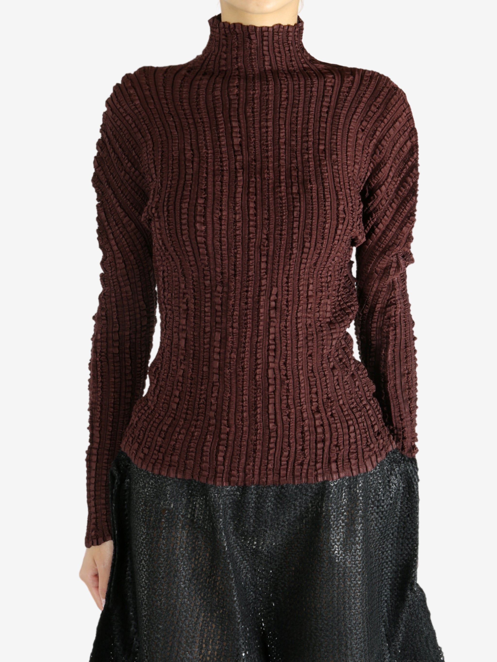 Brown shirt worn by a person, showing the shirt's fit