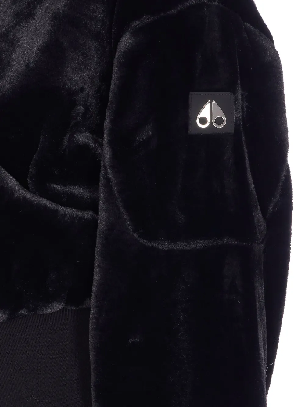 Close up of Black coat, showing texture of the cotton fabric