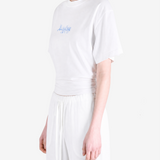 White t-shirt worn by a person, showing the t-shirt fit