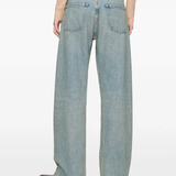 Blue jeans worn by a person, showing the jeans fit