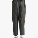 Grey pants worn by a person, showing the pants' fit