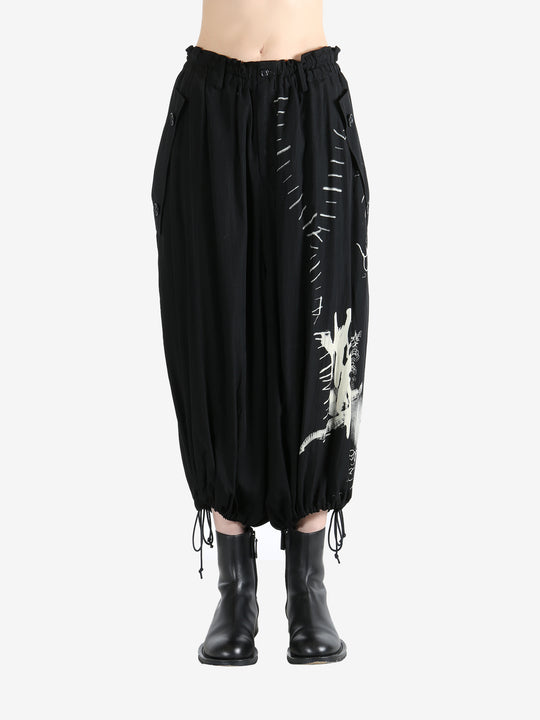 Black pants worn by a person, showing the pants fit