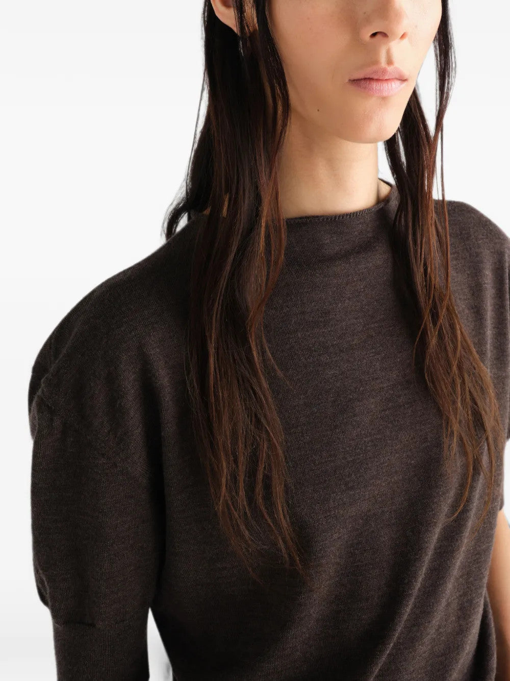 Brown knitwear worn by a person, showing the knitwear fit