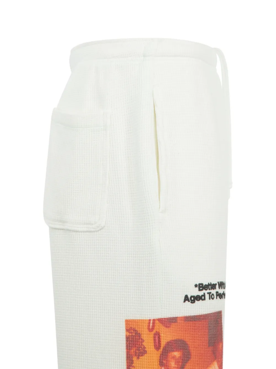 Close up of the white pants, showing  texture of the cotton